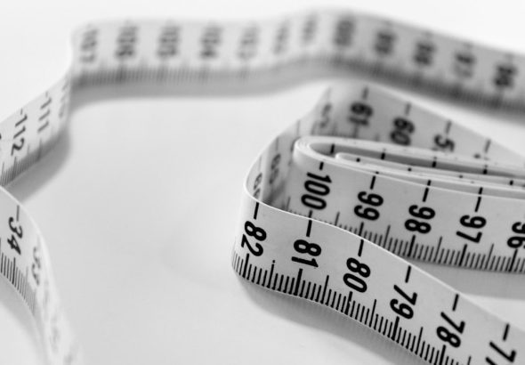 selective focus photography of tape measure