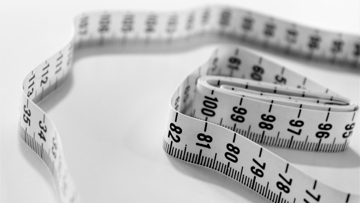 selective focus photography of tape measure